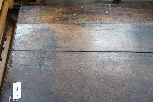 An 18th century and later carved panelled oak coffer, width 145cm, depth 58cm, height 61cm